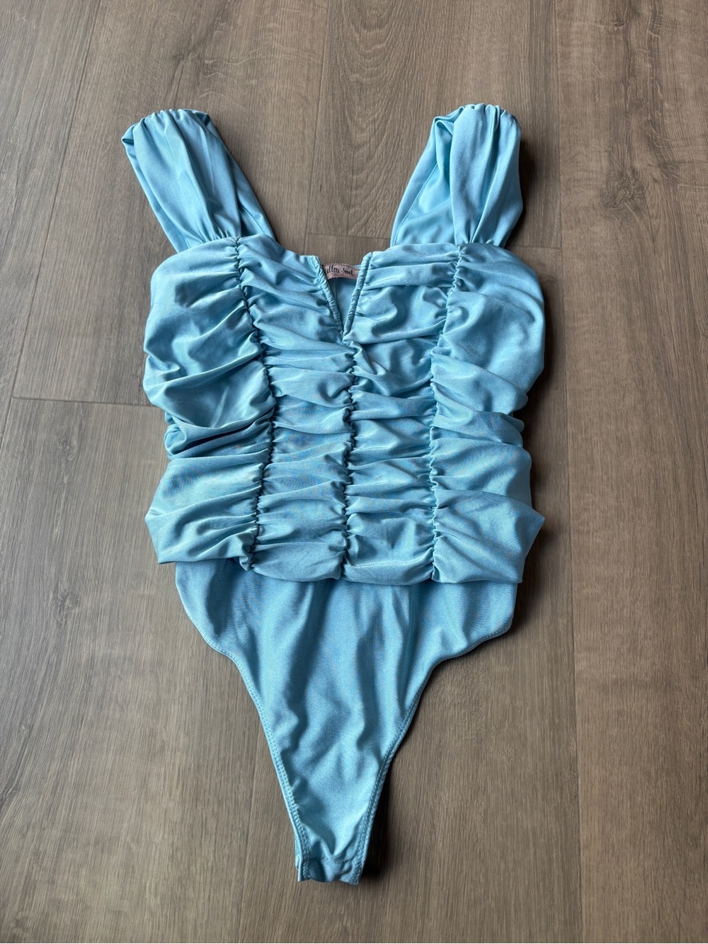 Buckle light blue ruched bodysuit
